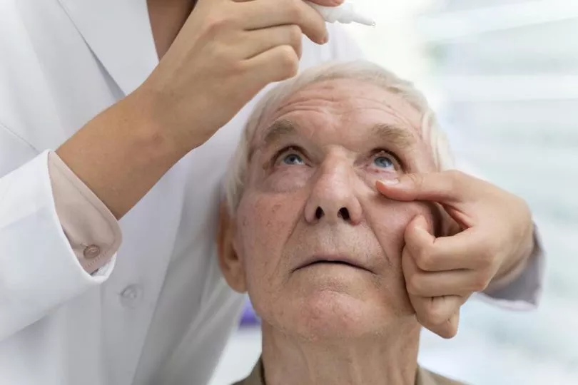 doctor-pouring-some-eye-drops-patient (1)